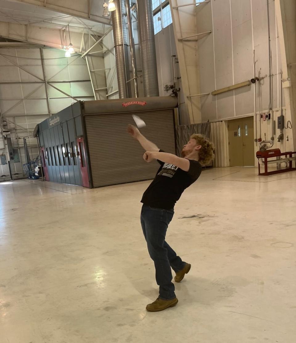 Evin Cooper sets the record for paper airplane flight time.