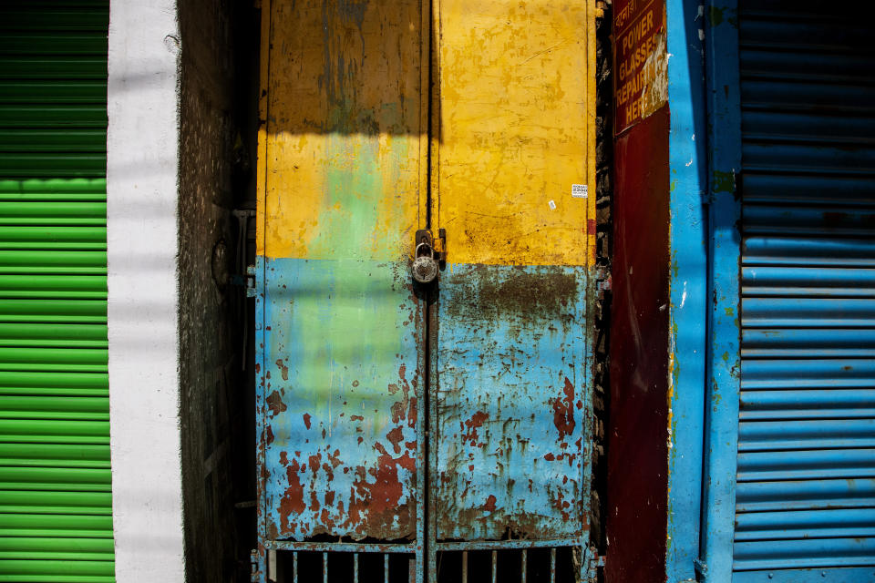 A shop is seen locked at a market area in Gauhati, India on June 18, 2021. Rows of locked shops confront bargain-hunters for most of the day in Fancy Bazar, a nearly 200-year-old market that offered cheap prices until the COVID-19 pandemic hit Gauhati, the biggest city in India’s remote northeast. (AP Photo/Anupam Nath)