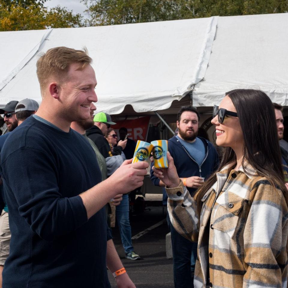 Guests with their five ounce souvenier sampling cups at BrewFest 2021.