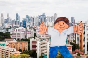 Paper doll in front of city scene, with arms outstretched