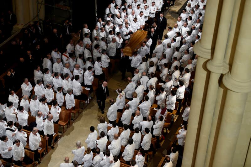 FILE PHOTO: Chefs carry the coffin of late French chef Paul Bocuse during the funeral ceremony at the Saint-Jean Cathedral in Lyon