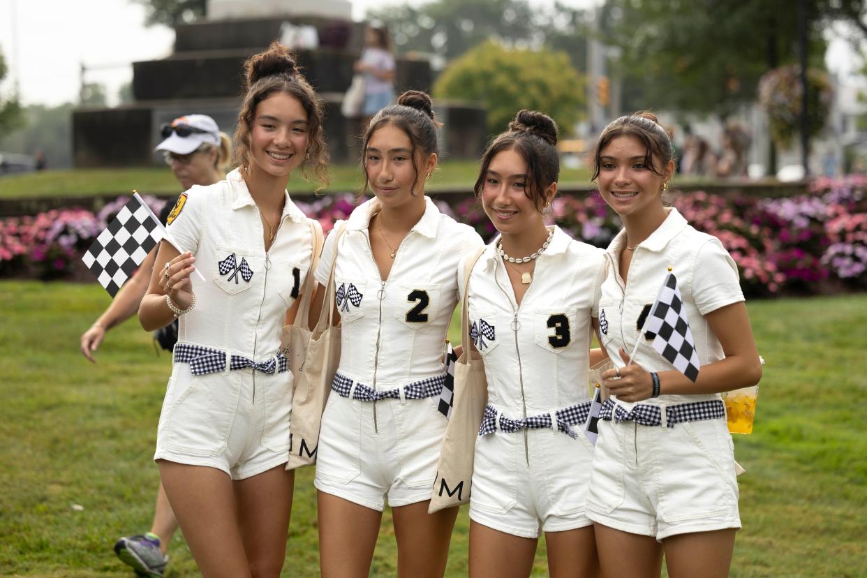 From left, quadruplet 17-year-old sisters Nina, Ally, Claire and Lauren Hudson gather for photos before the annual Twins Days Festival parade Saturday morning in Twinsburg.