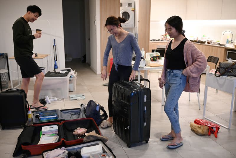 The Wider Image: Chinese students in Australia head home as coronavirus upends study