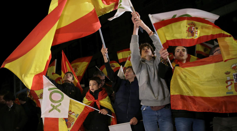 Boys join far-right Vox party supporters cheering outside the party headquarters after the announcement of the general election first results, in Madrid, Spain, Sunday, Nov. 10, 2019. Spain's Interior Ministry says that early results show Socialists winning Spain's national election, but without a clear end to the country's political deadlock. Vox is also surging to become the country's third political force, more than doubling its presence in the parliament's lower house from 24 to 53 deputies only six months after its debut. (AP Photo/Andrea Comas)