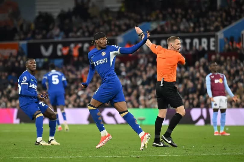 Noni Madueke of Chelsea celebrates scoring his team's first goal during the Premier League match with Aston Villa