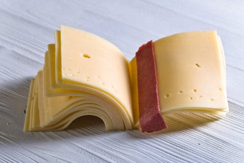 <span class="caption">A cheesy book.</span> <span class="attribution"><a class="link " href="https://www.shutterstock.com/image-photo/slices-cheese-folded-like-book-on-632114717?src=Wyc7t8AQWYkTosCz7Po7oA-1-75" rel="nofollow noopener" target="_blank" data-ylk="slk:Igor Normann/Shutterstock;elm:context_link;itc:0;sec:content-canvas">Igor Normann/Shutterstock</a></span>