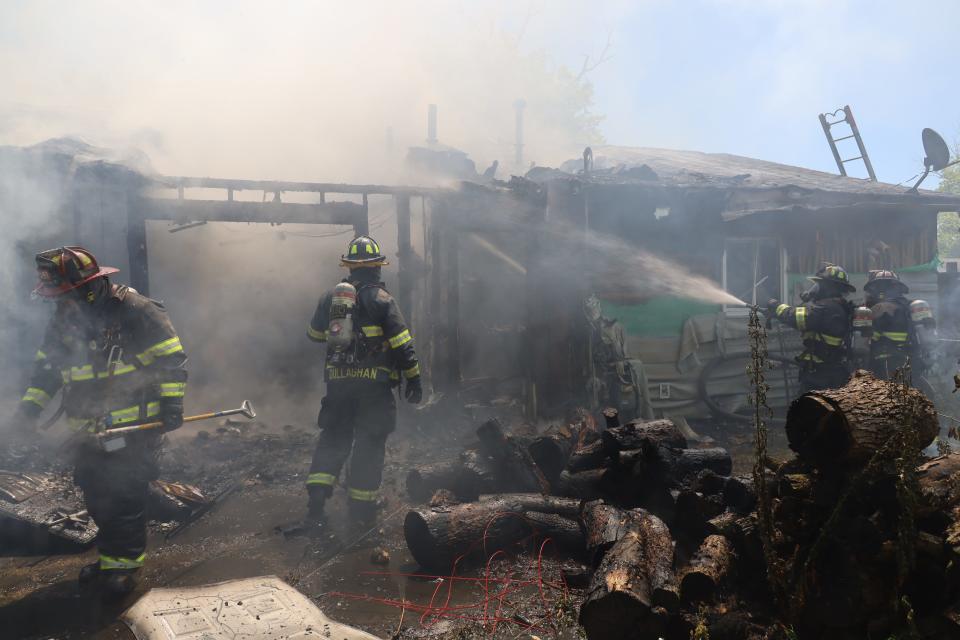 Firefighters work to put out a fire at the 3600 block of North Wittfield Street.