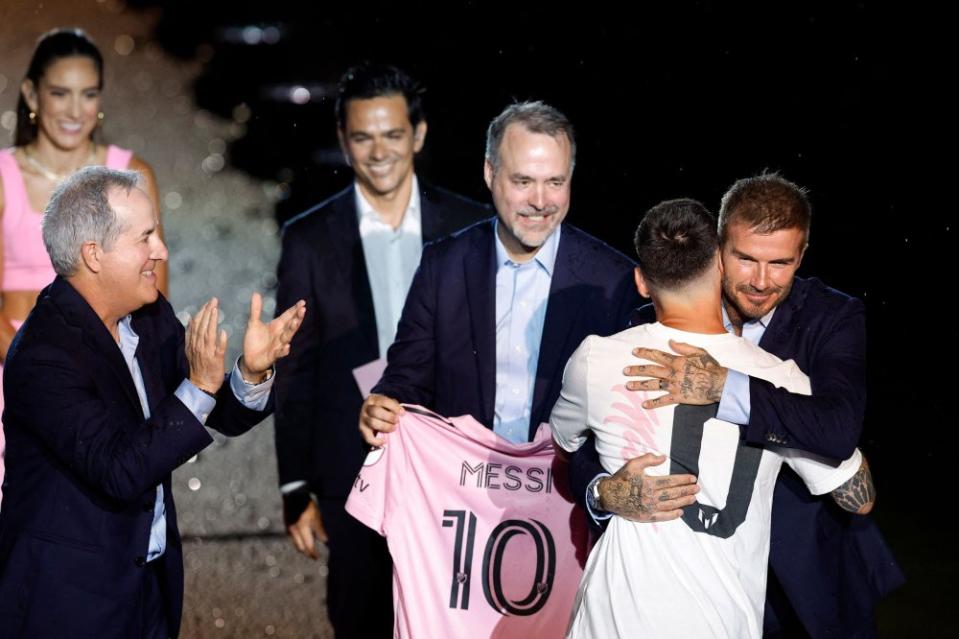 Inter Miami co-owner David Beckham hugs Messi on July 16, the day after the soccer star officially signed with Inter Miami.<span class="copyright">Marco Bello—Reuters</span>