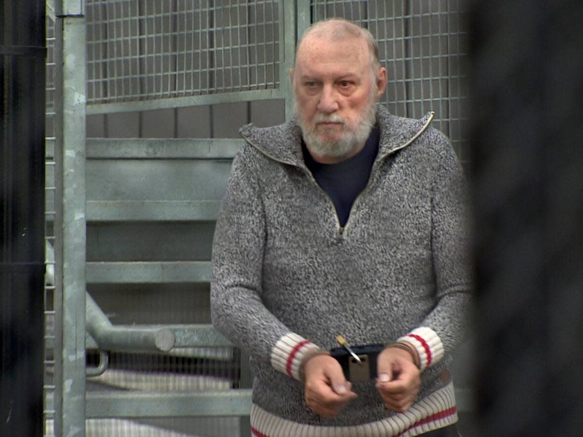 Former priest Eric Dejaeger, 76, leaves the Nunavut Court of Justice in Iqaluit on Thursday, June 8, after a brief court appearance.  (David Gunn/CBC  - image credit)