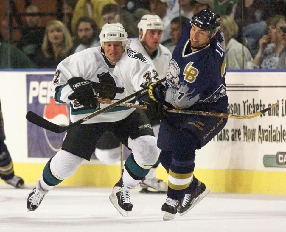 Grizzlies Brad Lauer and Ice Dog Steven Low fight for position. | Tom Smart, Deseret News