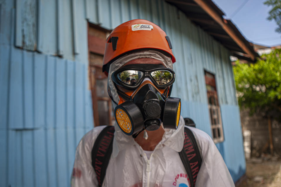 CENTRAL SULAWESI, INDONESIA - MARCH 23, 2020: Officers from the Central Sulawesi branch of Fast Action Response (ACT), prepared to spray disinfectants in a residential area in Palu City. This was done to prevent the spread of the coronavirus (Covid-19). - PHOTOGRAPH BY Opan Bustan / Opn Images/ Barcroft Studios / Future Publishing (Photo credit should read Opan Bustan / Opn Images/Barcroft Media via Getty Images)