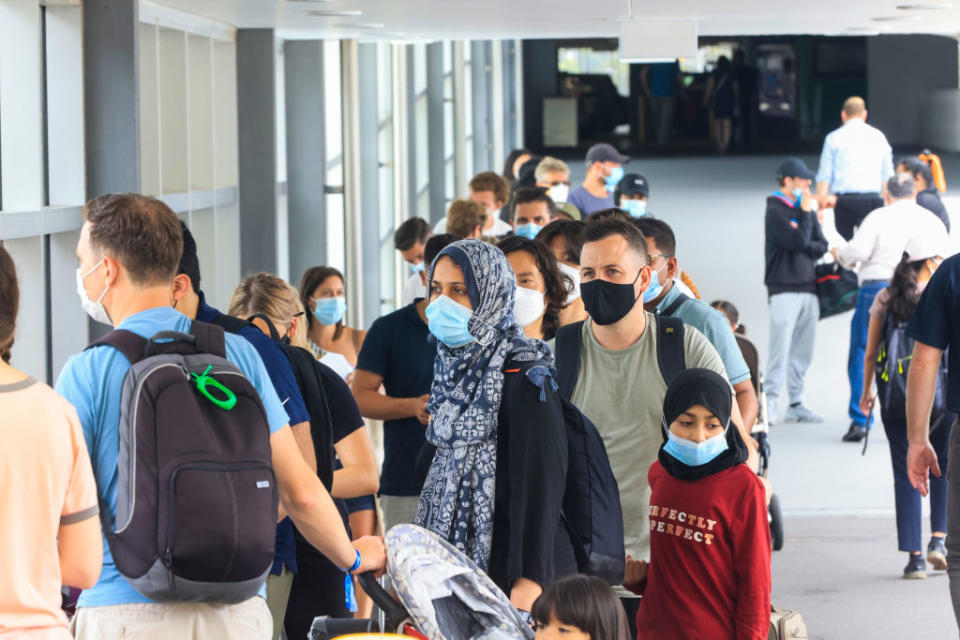 People line up at the Histopath pre-departure COVID testing clinic at Sydney International airport in Sydney, Australia. 