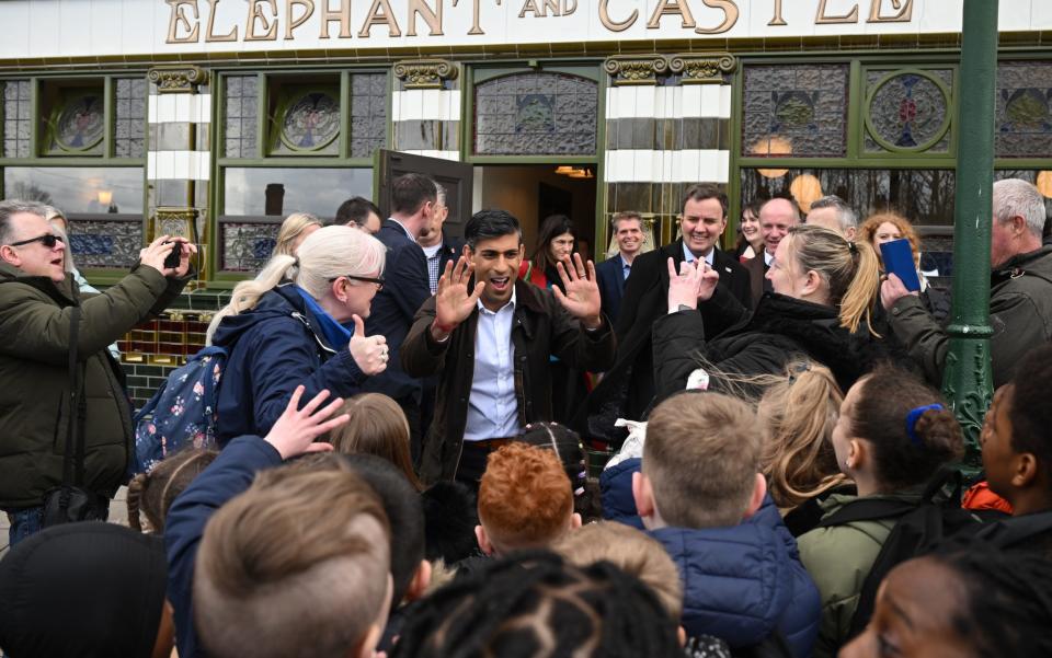 Rishi Sunak meets children outside a replica pub as he makes a Conservative Party campaign visit to Dudley this afternoon - Leon Neal /Getty Images Europe 