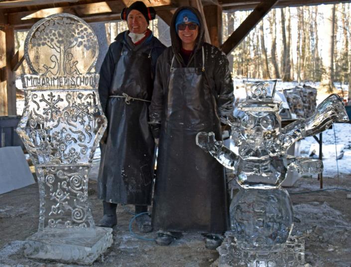 Ice sculptors Dave Soha, at left, and Dennis Hickey of Ice Breakers stand next to their finished creations in the Moharimet Elementary School Sugar Shack on Wednesday, Jan. 26.