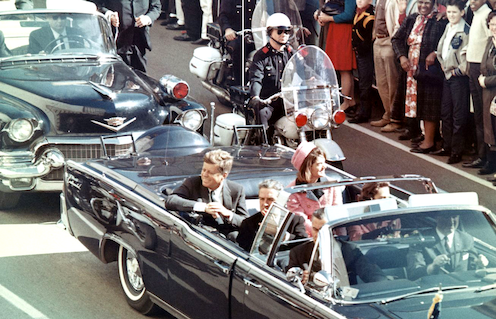 <span class="caption">John F. Kennedy and Jackie Kennedy in the limousine in Dallas minutes before the assassination. </span> <span class="attribution"><a class="link " href="https://en.wikipedia.org/wiki/File:JFK_limousine.png" rel="nofollow noopener" target="_blank" data-ylk="slk:Walt Cisco/Dallas Morning News;elm:context_link;itc:0;sec:content-canvas">Walt Cisco/Dallas Morning News</a></span>