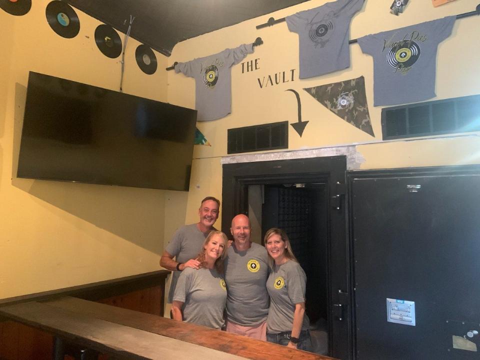 Vinyl Pies Pizza is located at 164 Bridge Street in downtown Hot Springs. The new pizzeria's owners, Karen Goss, right, and Gary Goss, second from right, and their business partners,  Ashley Skipper and Marty Martin, decided to keep the bank's vault and will sell t-shirts and store merchandise out of it.