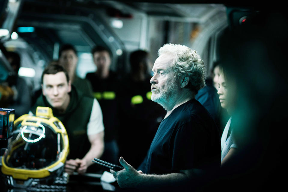 ALIEN: COVENANT, Michael Fassbender (back left), director Ridley Scott (front), on set, 2017. ph: Mark Rogers /TM and copyright © Twentieth Century Fox Film Corporation. All rights reserved./ Courtesy Everett Collection