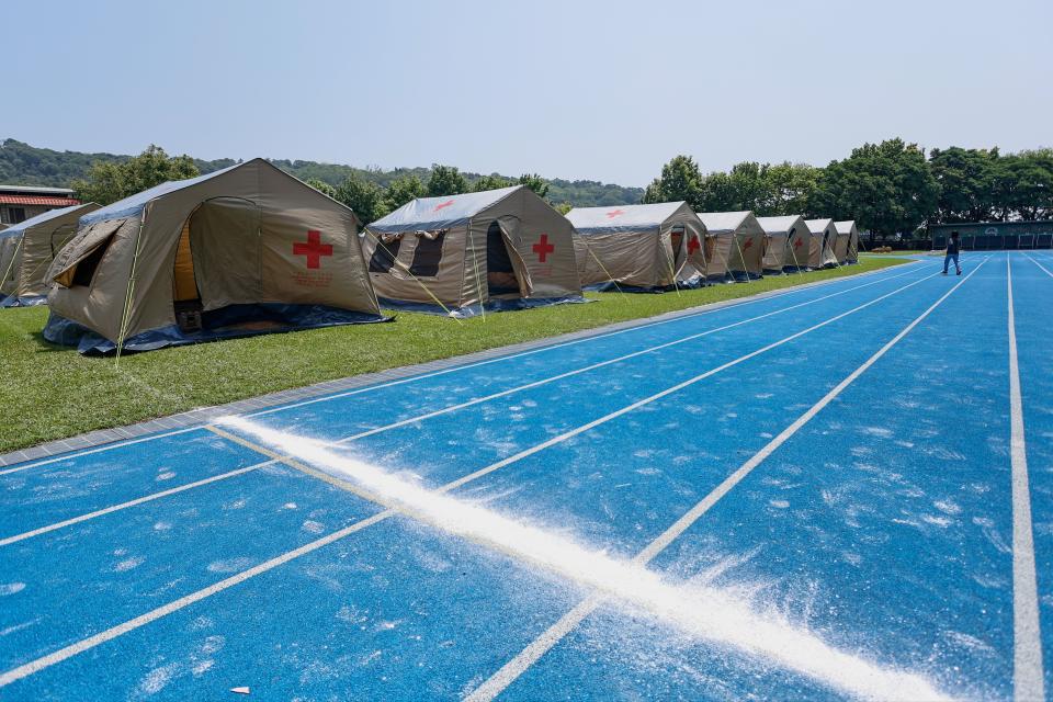 Tents donated by the Red Cross Society of Taiwan are set up at a primary-school-turned shelter (EPA)