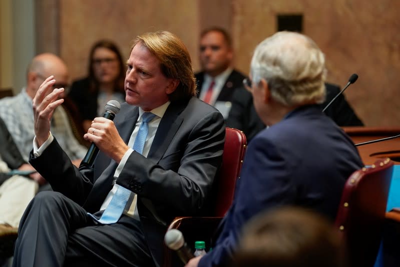 Former White House counsel Don McGahn sits with Senate Majority Leader Mitch McConnell while speaking to a gathering of the Federalist Society at the State Capitol in Frankfort