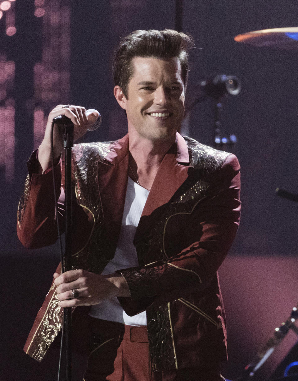 FILE - This April 14, 2018 file photo shows Brandon Flowers performing at the 2018 Rock and Roll Hall of Fame Induction Ceremony in Cleveland. The spreading coronavirus might have canceled several touring performances from A-list musical artists, but those acts have found creative ways to communicate with their fans. Flowers of The Killers tweeted a video of him washing his hands while singing the band’s signature hit, “Mr. Brightside." (Photo by Michael Zorn/Invision/AP, File)