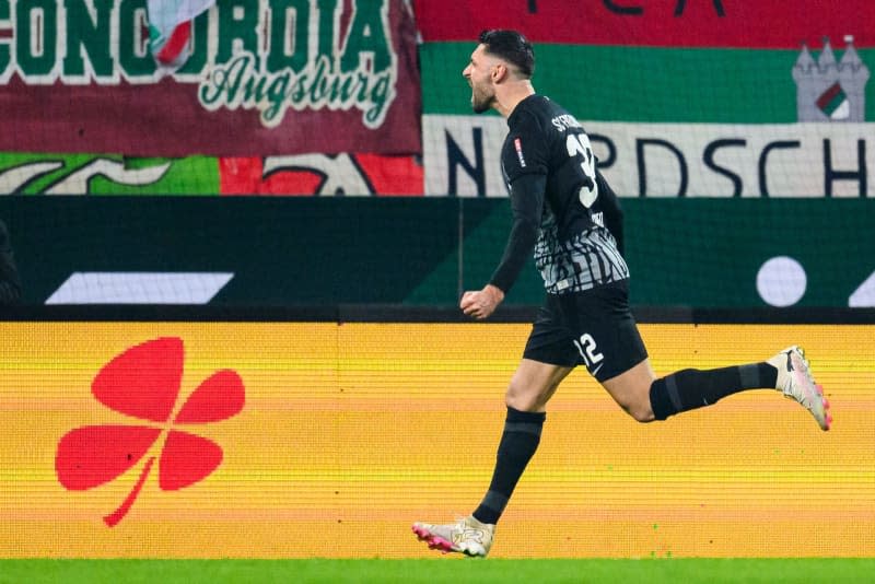Freiburg's Vincenzo Grifo celebrates scoring his side's first goal during the German Bundesliga soccer match between FC Augsburg and SC Freiburg at WWK-Arena. Tom Weller/dpa