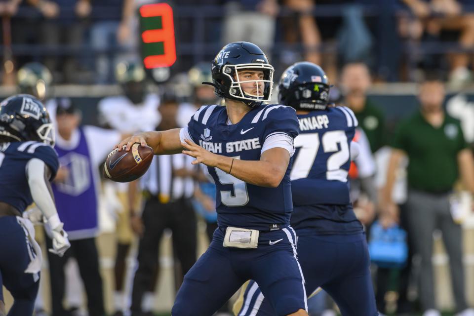 Utah State QB Cooper Legas looks to throw against Colorado State on Oct. 7, 2023, in Logan, Utah. Legas will be among the Aggie QBs vying for QB1 duties next season. | Tyler Tate, Associated Press