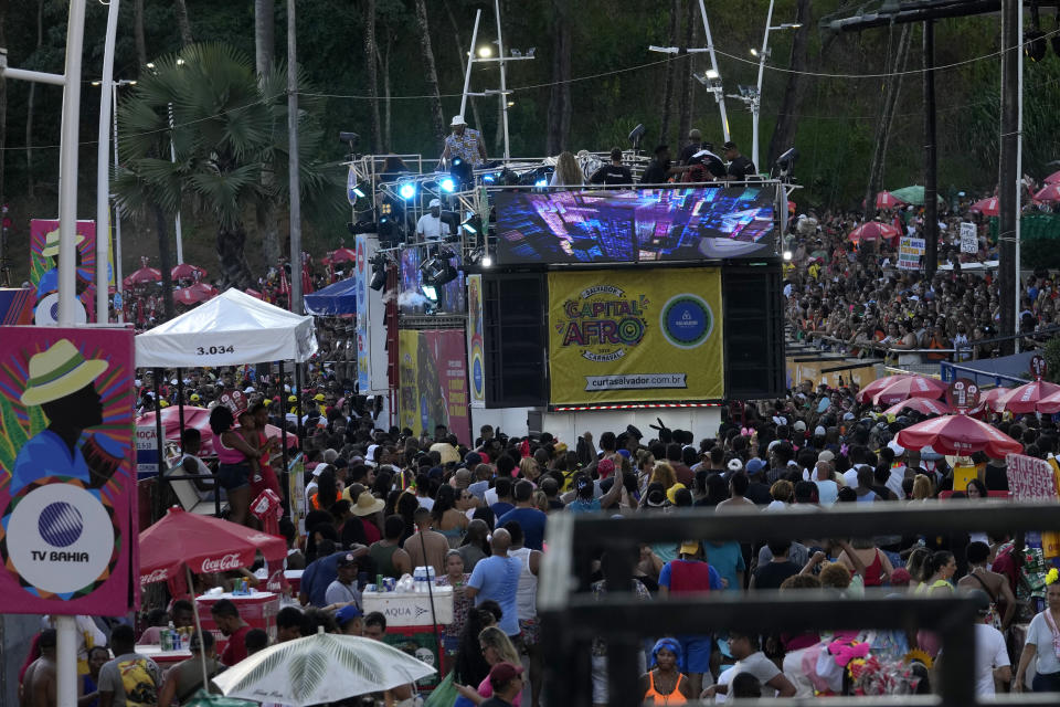 A giant sound truck popularly referred to as an electric trio makes its way through an avenue during Carnival festivities, in Salvador, Bahia state, Brazil, Sunday, Feb. 4, 2024. During Carnival this year, as many as 70 electric trios will plod through the swarming crowds each day of the pre-Lenten festivities. (AP Photo/Eraldo Peres)