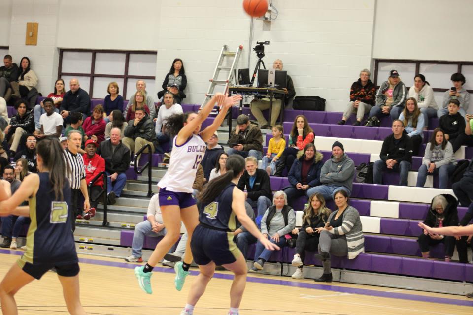 Monty Tech's Kylie Neseran shoots over Elisabeth Gardiner in the Bulldogs' game against St. Bernard's on Dec. 8, 2023.