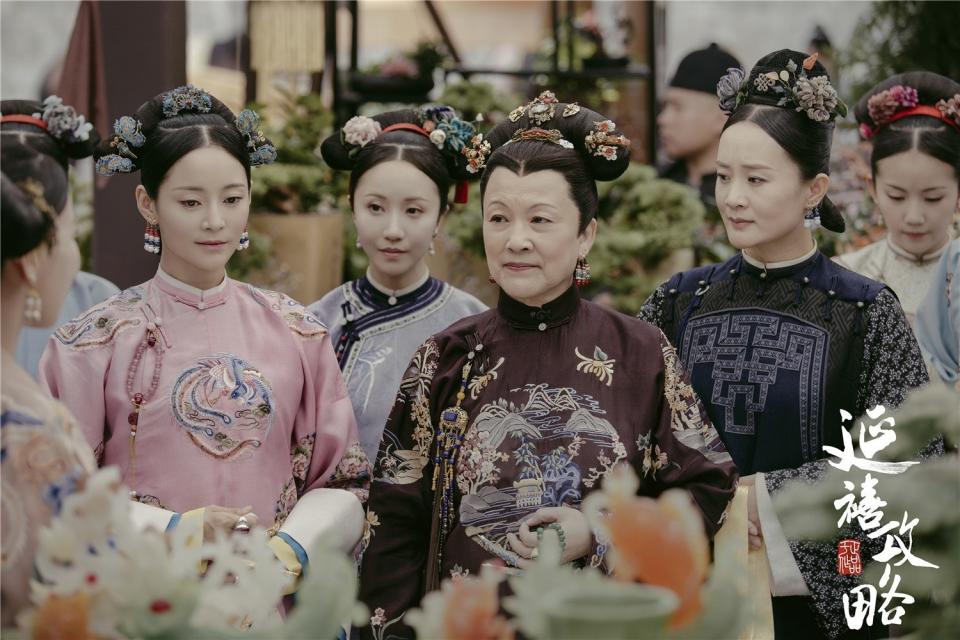 A group of woman in traditional Chinese outfits.