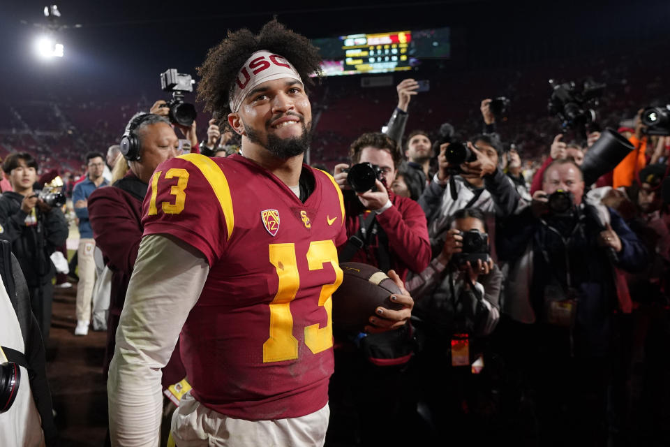 FILE - Southern California quarterback Caleb Williams smiles after USC defeated Notre Dame 38-27 in an NCAA college football game Saturday, Nov. 26, 2022, in Los Angeles. Caleb Williams was named to The Associated Press preseason All-America team, Monday, Aug. 21, 2023. (AP Photo/Mark J. Terrill, File)