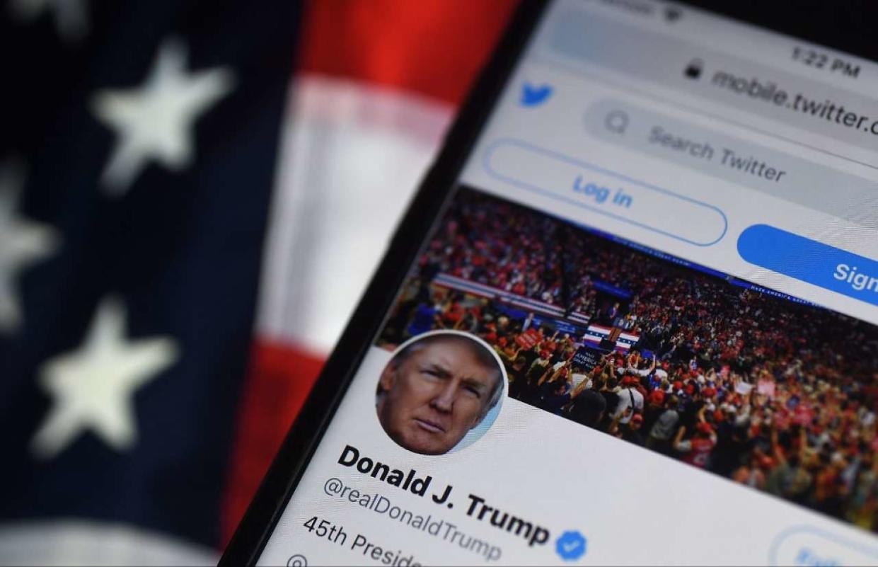 (FILES) In this file photo illustration taken on August 10, 2020 , the Twitter account of US President Donald Trump is displayed on a mobile phone in Arlington, Virginia. - New Twitter owner Elon Musk said on November 2, 2022, that it will be 