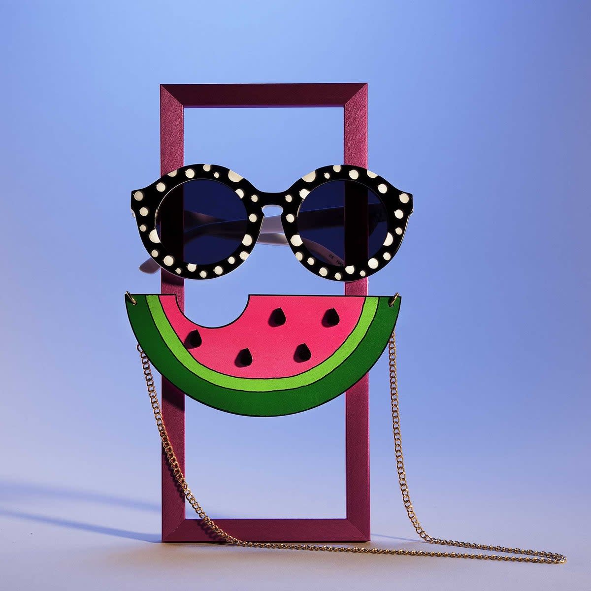 Sunglasses, £150, Henry Holland; watermelon necklace, £85, Browns; frame, £5, John Lewis