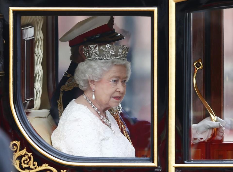 <div class="inline-image__caption"><p>Britain’s Queen Elizabeth II, accompanied by Prince Philip, in the new Diamond Jubilee State Coach, in central London, June 4, 2014.</p></div> <div class="inline-image__credit">Eddie Keogh/Reuters</div>