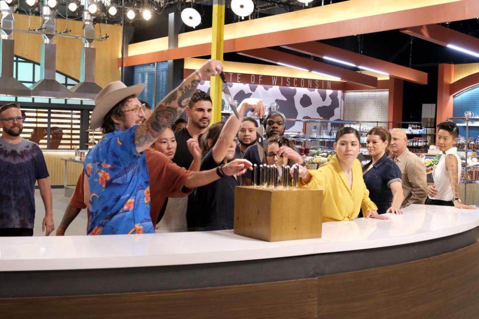 TOP CHEF -- Chef's Test Episode 2101 -- Pictured: (l-r) Daniel Jacobs, David Murphy, Kaleena Bliss, Manuel "Manny" Barella Lopez, Savannah Miller, Kenny Nguyen, Charly Pierre, Iisha Elenz, Laura Ozyilmaz, Gail Simmons, Tom Colicchio, Kristen Kish -- (Photo by: David Moir/Bravo)