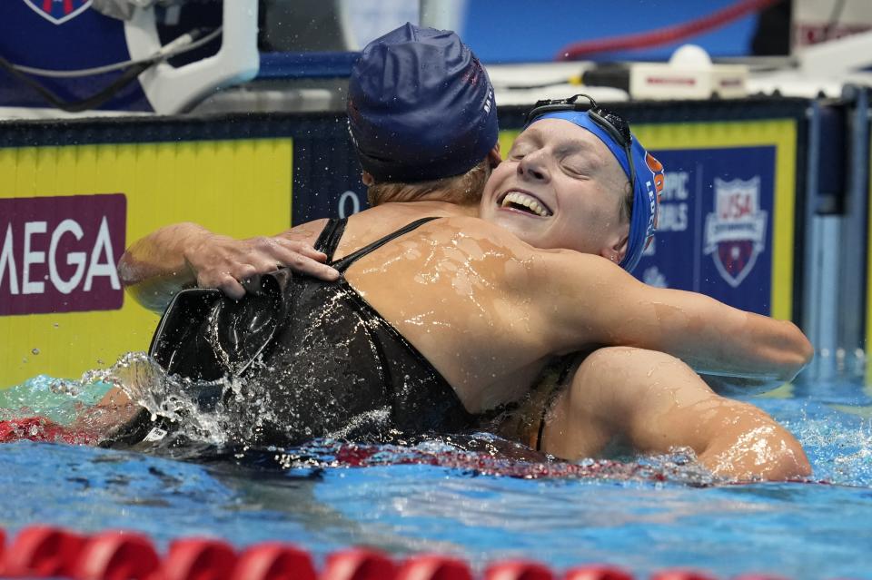 Katie Ledecky is congratulated by Paige Madden after winning the Women's 400 freestyle finals heat Saturday, June 15, 2024, at the US Swimming Olympic Trials in Indianapolis. (AP Photo/Michael Conroy)