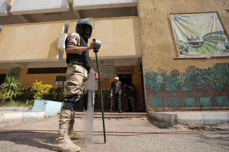 An army soldier stands guard at a polling station, during the referendum on draft constitutional amendments, in Cairo, Egypt April 20, 2019. REUTERS/Mohamed Abd El Ghany