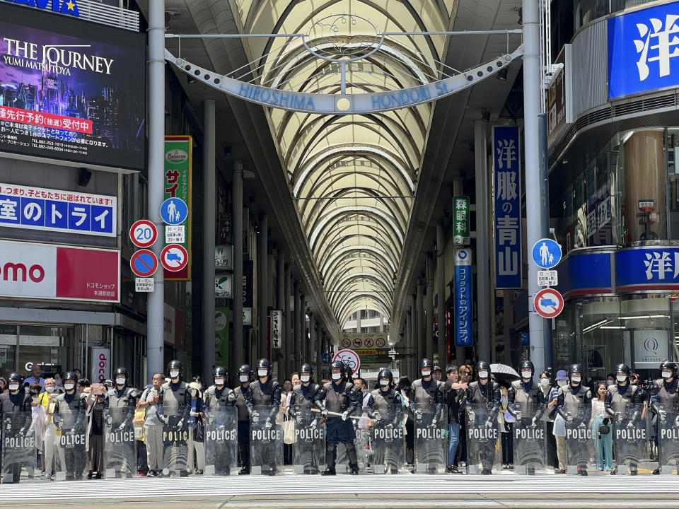 Police prepare to confront protesters marching against the Group of Seven (G7) meeting being held in Hiroshima, western Japan, Sunday, May 21, 2023. (AP Photo/Adam Schreck)