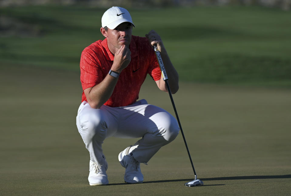 Rory McIlroy, of Northern Ireland, surveys his shot on the 18th green during the final round of the CJ Cup golf tournament Sunday, Oct. 17, 2021, in Las Vegas. (AP Photo/David Becker)