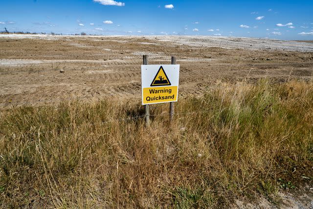 <p>Getty</p> A warning sign about quicksand.