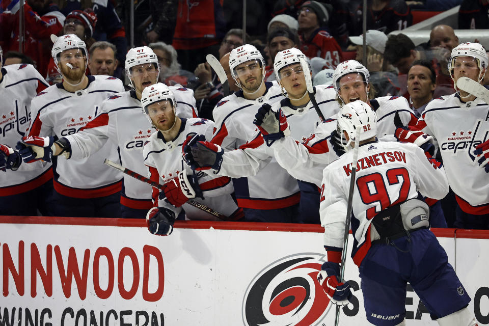 Washington Capitals' Evgeny Kuznetsov (92) celebrates after scoring during a shootout against the Carolina Hurricanes in an NHL hockey game in Raleigh, N.C., Sunday, Dec. 17, 2023. (AP Photo/Karl B DeBlaker)