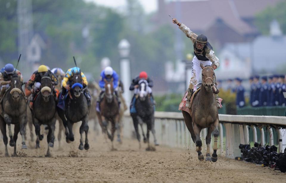 Jockey Calvin Borel celebrates after winning the 2009 Kentucky Derby aboard long shot Mine That Bird.