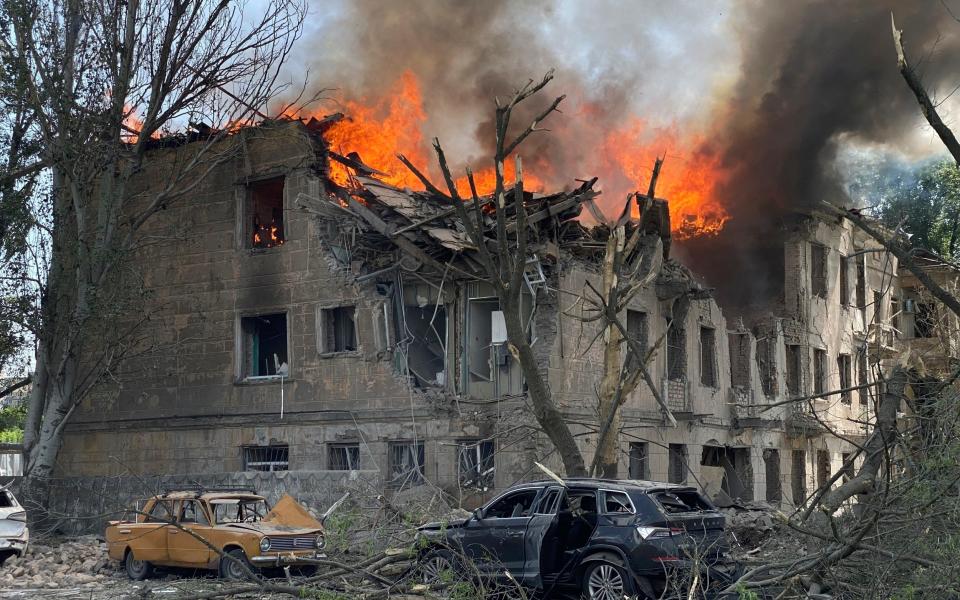 Firefighters hose down a Policlinic following a Russian attack in Dnipro - State Emergency Service of Ukraine/AP