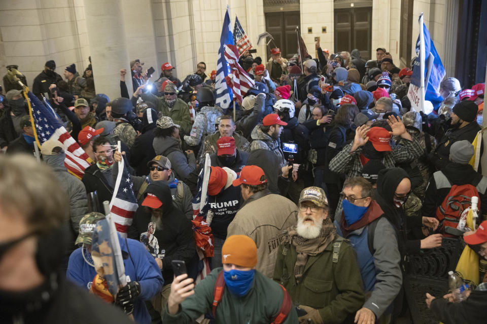 Watching footage of pro-Trump rioters, seen here inside the U.S. Capitol, can be highly stressful, explain experts on trauma. (Photo: Win McNamee/Getty Images)