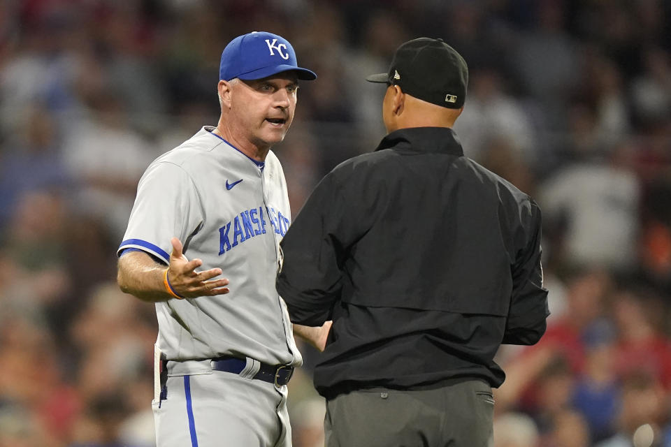 Kansas City Royals manager Matt Quatraro, left, appeals a call with first base umpire Vic Carapazza, right, in the ninth inning of a baseball game, Monday, Aug. 7, 2023, in Boston. (AP Photo/Steven Senne)