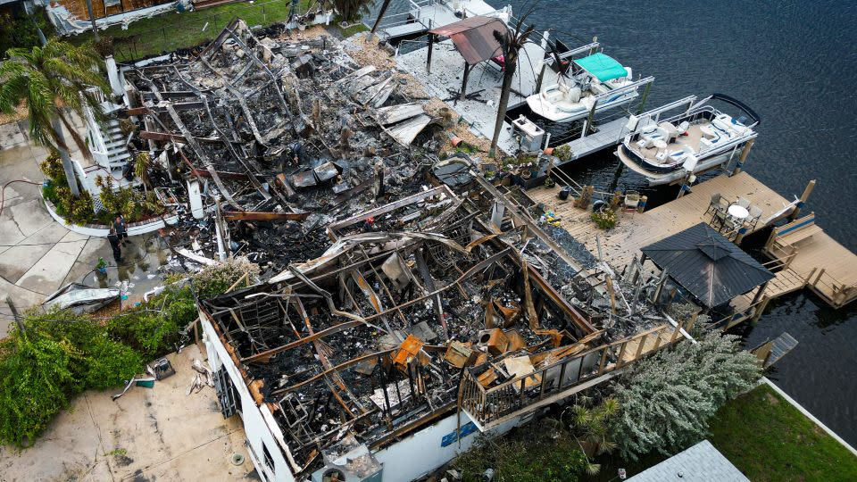 Aerial view of the charred remains of a house that burned down after a power transformer explosion Wednesday in Hudson, Florida. - Miguel J. Rodriguez Carrillo/AFP/Getty Images