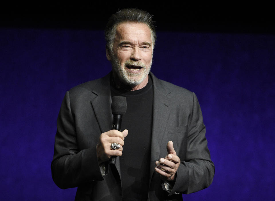 FILE - In this Thursday, April 4, 2019 file photo, Arnold Schwarzenegger, a cast member in the upcoming film "Terminator: Dark Fate," discusses the film during the Paramount Pictures presentation at CinemaCon 2019, the official convention of the National Association of Theatre Owners (NATO) at Caesars Palace, in Las Vegas. New video on Saturday, May 18, 2019 shows actor Arnold Schwarzenegger being assaulted during a public appearance in South Africa. It shows the 71-year-old standing and filming children at a sporting event in Johannesburg when a man makes a flying kick into his back. (Photo by Chris Pizzello/Invision/AP, File)