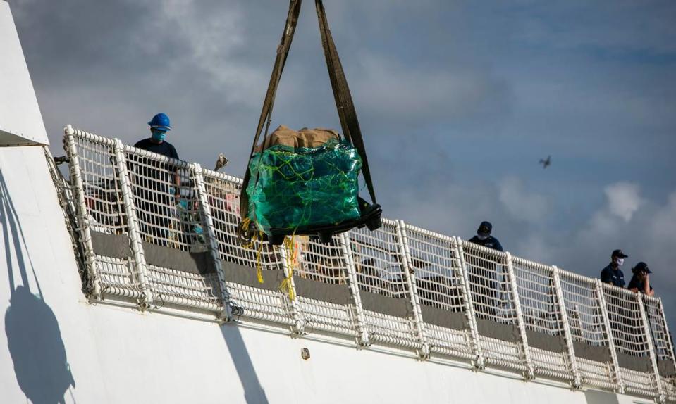 A pallet of seized drugs is taken from the deck of the U.S. Coast Guard Cutter James to Port Everglades, Fort Lauderdale on Aug. 5, 2021. The U.S. Coast Guard and Canadian military held a drug offload with about 59,700 pounds of cocaine and 1,430 pounds of marijuana from multiple Eastern Pacific and Caribbean Sea interdictions.