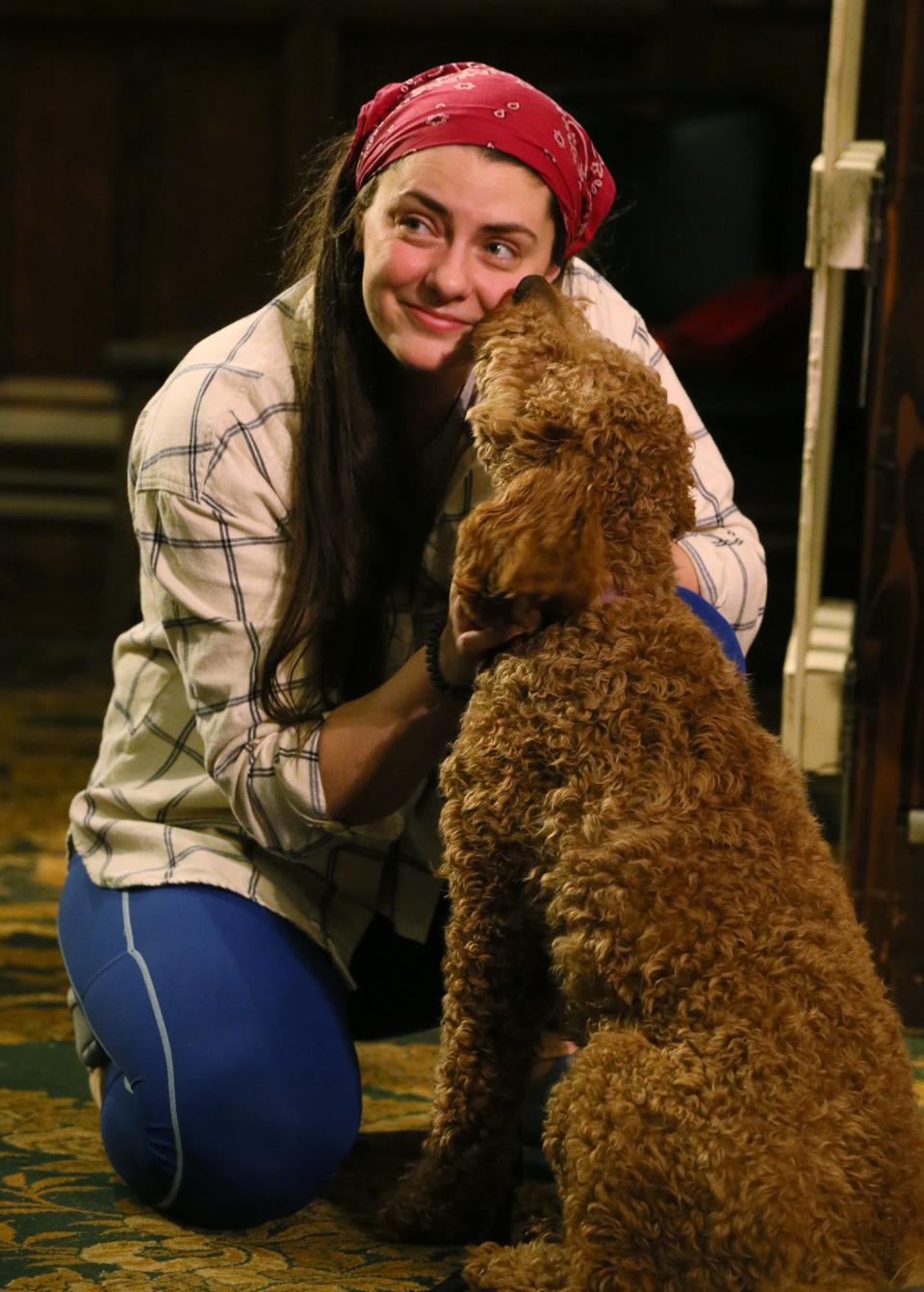 Natalie Steen as Dorothy gets a kiss from "Toto" during Ohio Shakespeare Festival's rehearsal of "The Wizard of Oz" on Wednesday, April 17, 2024 in Akron.