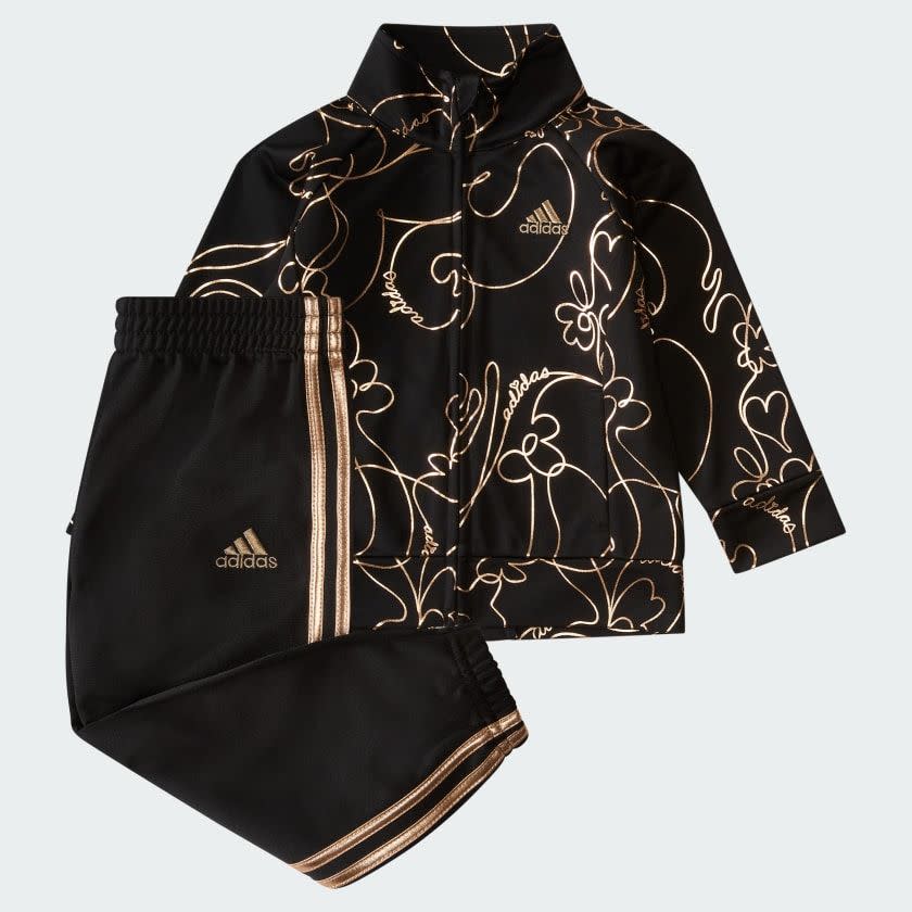 <p><a href="https://go.redirectingat.com?id=74968X1596630&url=https%3A%2F%2Fwww.adidas.com%2Fus%2Ftwo-piece-printed-glam-tricot-track-set%2FIR2981.html&sref=https%3A%2F%2F" rel="nofollow noopener" target="_blank" data-ylk="slk:Shop Now;elm:context_link;itc:0;sec:content-canvas" class="link ">Shop Now</a></p><p>Two-Piece Printed Glam Tricot Track Set</p><p>adidas.com</p><p>$34.00</p>