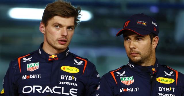 Max Verstappen speaks with Red Bull team-mate Sergio Perez. Bahrain, March 2023. Credit: Alamy